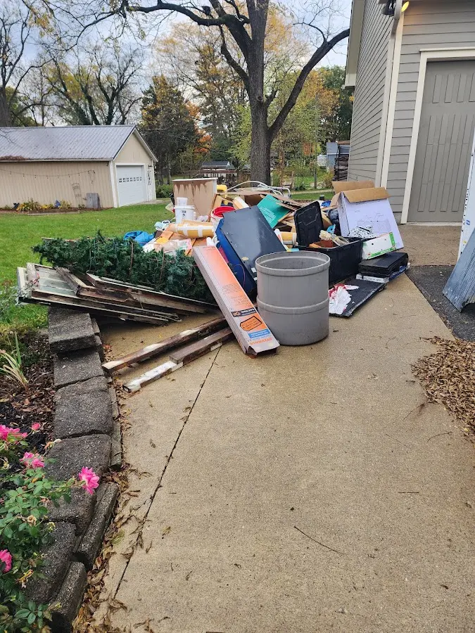 Dumpster being loaded with debris for Roofing Dumpster Rental in Eden Isle